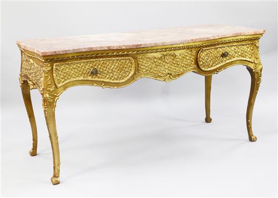 A Louis XV style serpentine gilt side table, W.5ft 2in.